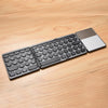 GK408 Teclado de Bluetooth inalámbrico recargable de tres veces con TouchPad, Soporte Android / iOS / Windows (Negro Gray)