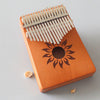 Piano de pulgar portátil Kalimba de 17 tonos, estilo: dios de caoba-sol